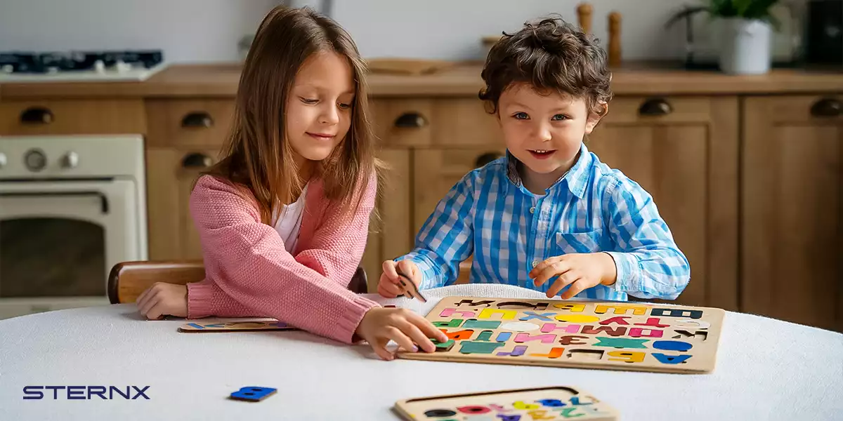 Two kids playing board games practicing digital detox